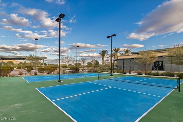 view of sport court with fence