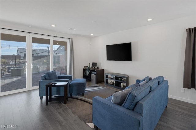 living room featuring recessed lighting, baseboards, and dark wood-style flooring