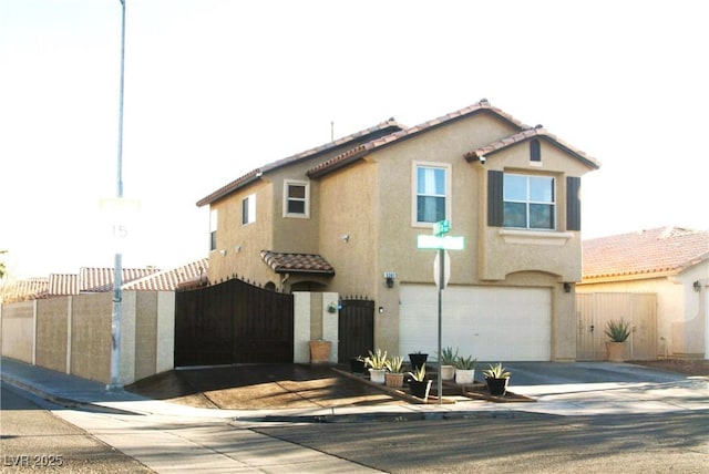 view of front facade featuring stucco siding, a tiled roof, concrete driveway, and a garage