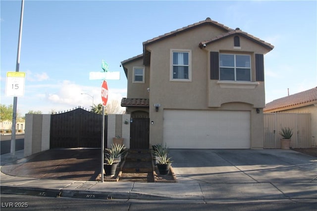 traditional-style home with a tiled roof, a gate, an attached garage, and stucco siding