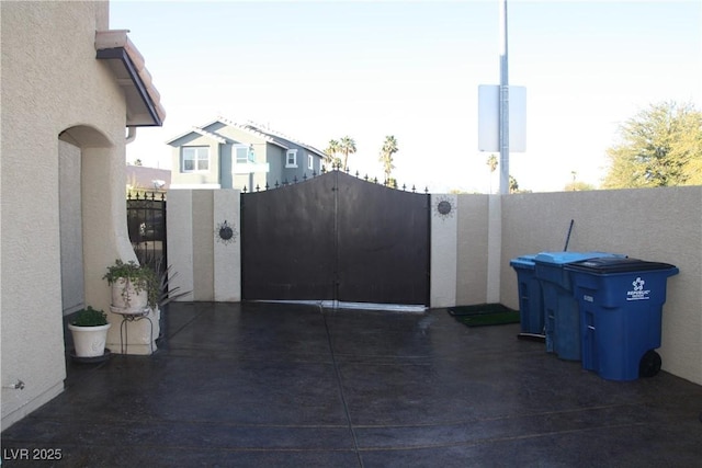 view of gate featuring fence