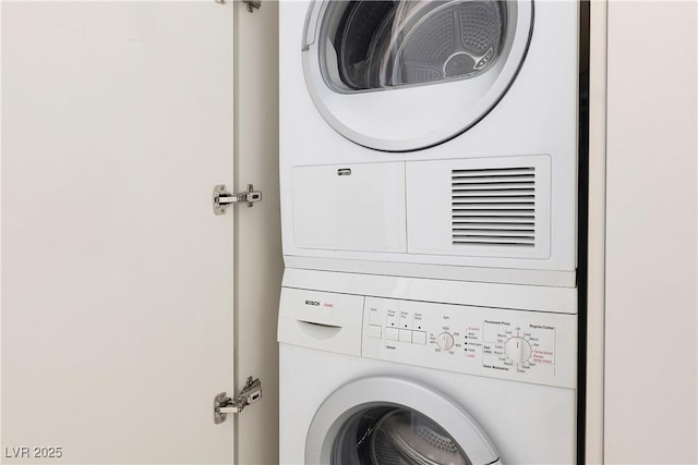 laundry room with laundry area and stacked washer / drying machine