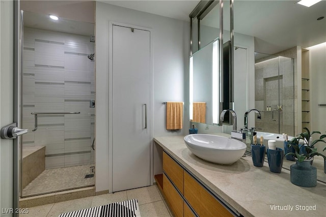 bathroom featuring a shower stall, vanity, and speckled floor