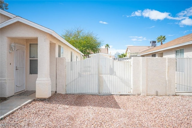 view of gate with fence