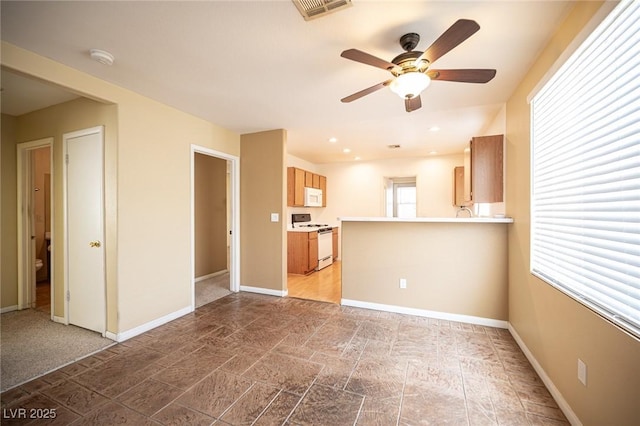 unfurnished living room featuring recessed lighting, visible vents, baseboards, and a ceiling fan