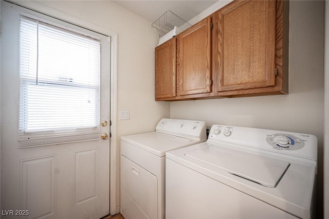 clothes washing area with cabinet space and separate washer and dryer