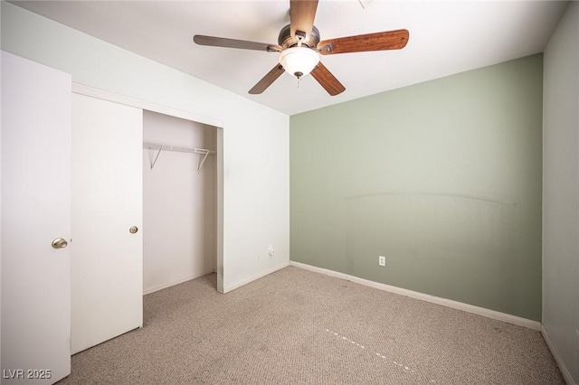 unfurnished bedroom featuring a closet, carpet floors, baseboards, and a ceiling fan