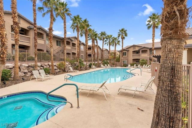 pool featuring a patio area, a residential view, and fence