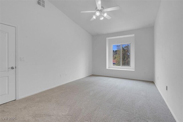 carpeted empty room featuring visible vents and ceiling fan