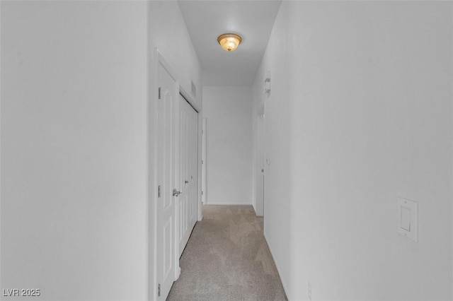 corridor with light carpet