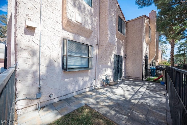 3369 Milenko Dr, Las Vegas, NV 89121 - view of side of property with stucco siding
