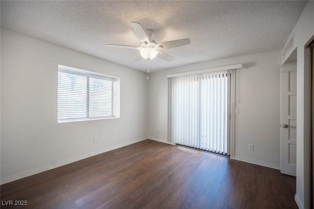 3369 Milenko Dr, Las Vegas, NV 89121 - spare room with a ceiling fan, dark wood-style flooring, a textured ceiling, and baseboards