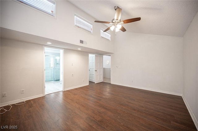 3369 Milenko Dr, Las Vegas, NV 89121 - spare room with a ceiling fan, dark wood-style floors, baseboards, high vaulted ceiling, and a textured ceiling