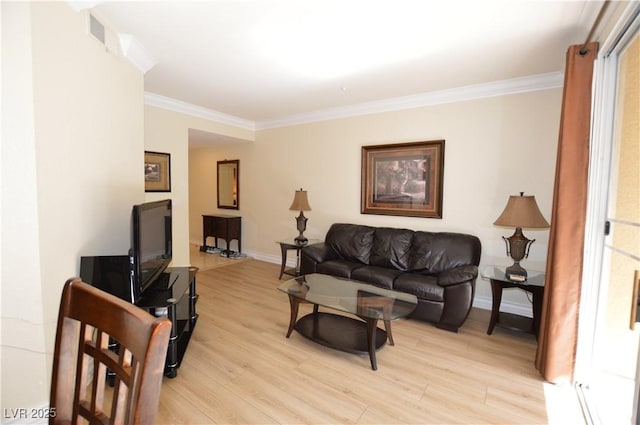 living area featuring crown molding, light wood-style floors, and baseboards