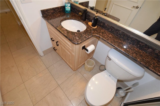 half bath with toilet and vanity