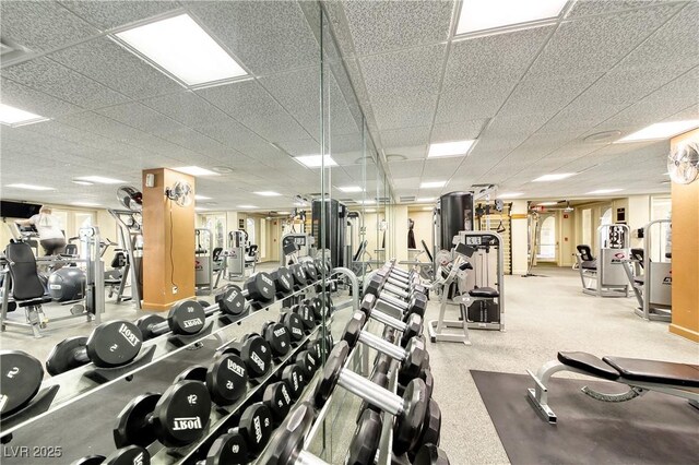 exercise room with a paneled ceiling