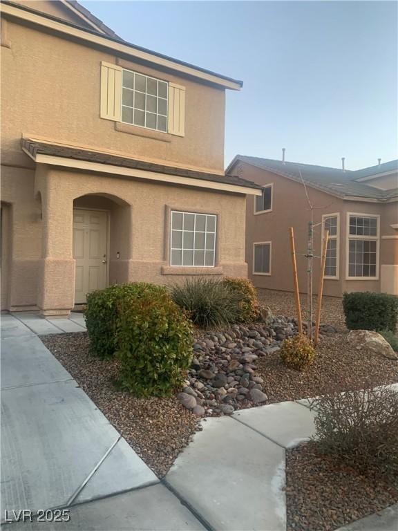 exterior space featuring stucco siding