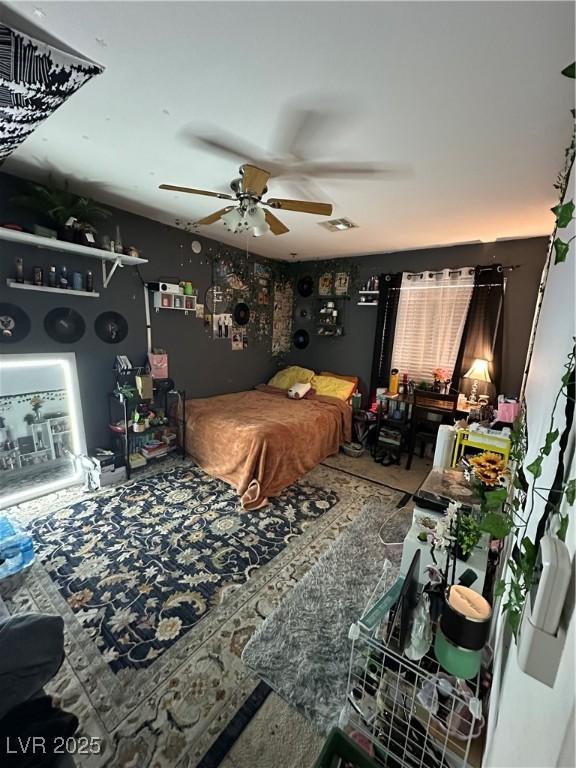 bedroom with a ceiling fan and visible vents