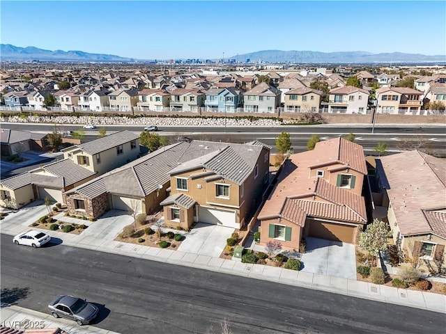 aerial view with a mountain view and a residential view