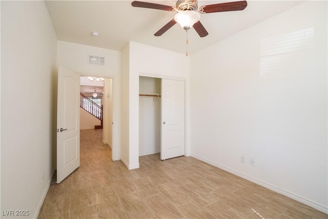 unfurnished bedroom with baseboards, visible vents, a closet, and ceiling fan