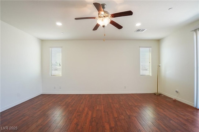 unfurnished room featuring recessed lighting, visible vents, baseboards, and hardwood / wood-style floors