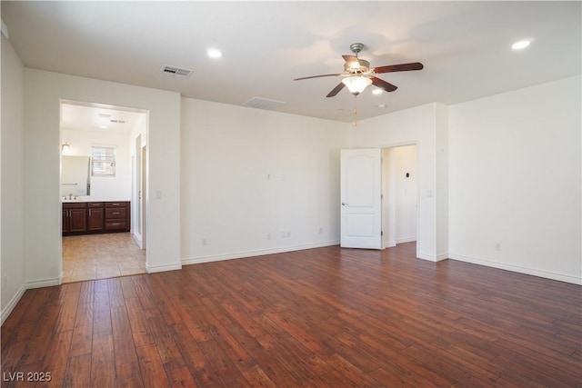 empty room with recessed lighting, visible vents, dark wood finished floors, and a ceiling fan