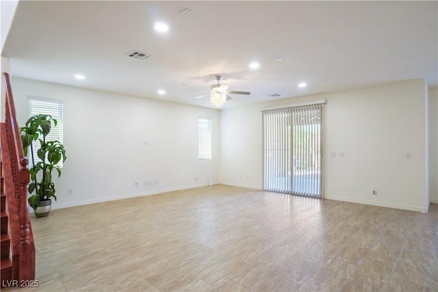 spare room with a ceiling fan, recessed lighting, visible vents, and baseboards