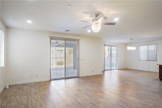 spare room with visible vents, baseboards, recessed lighting, ceiling fan, and light wood-style floors