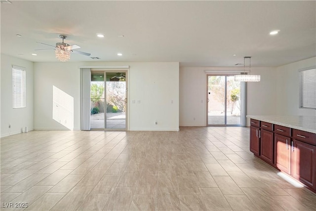 unfurnished living room with visible vents, recessed lighting, baseboards, and ceiling fan