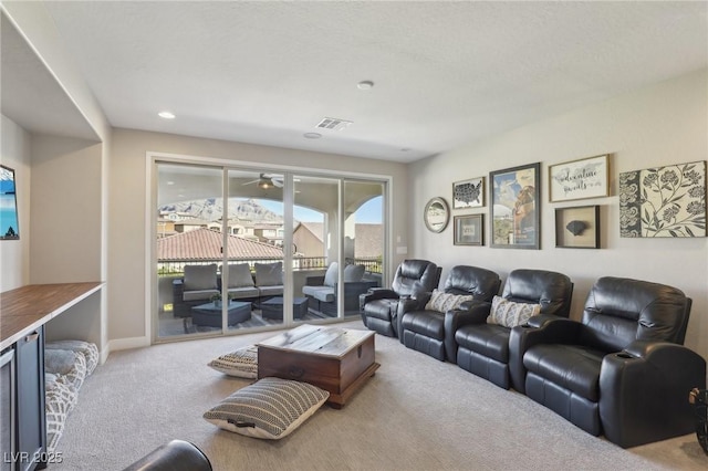 carpeted home theater room featuring recessed lighting, visible vents, and baseboards