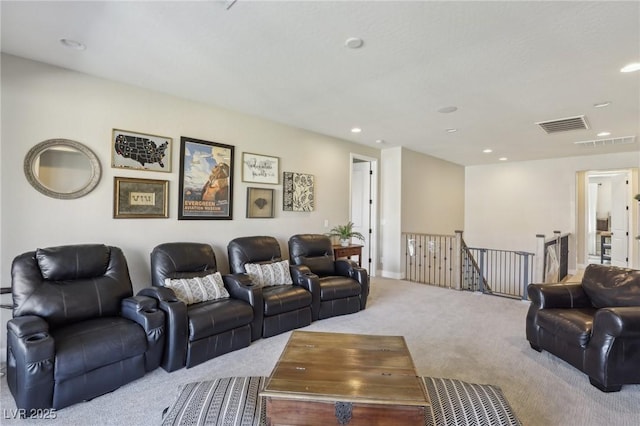 living area with carpet flooring, recessed lighting, and visible vents