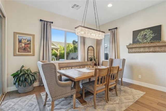 dining room with recessed lighting, wood finished floors, visible vents, and baseboards