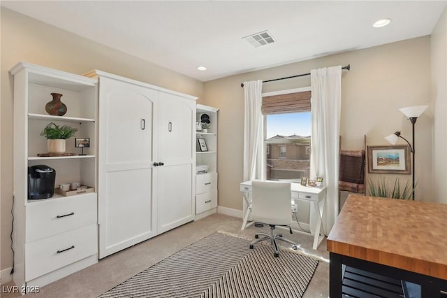 office space featuring recessed lighting, visible vents, and light colored carpet