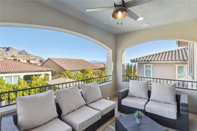 balcony with a ceiling fan and an outdoor hangout area