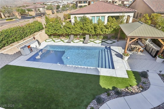 view of pool with a patio area, a lawn, a gazebo, and a fenced in pool