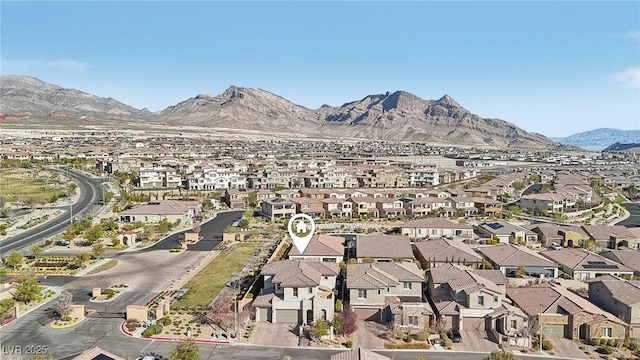 birds eye view of property with a residential view and a mountain view