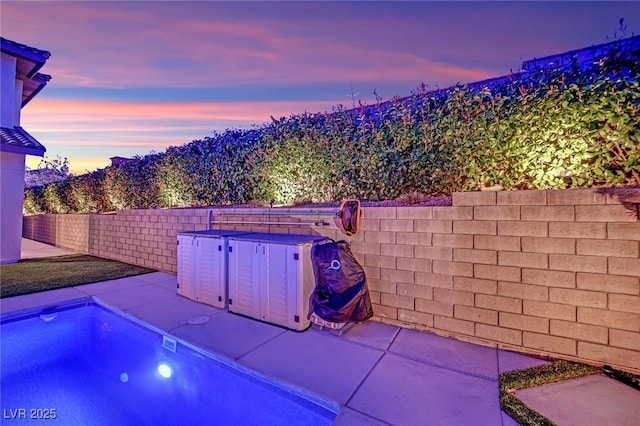 exterior space with a patio and fence