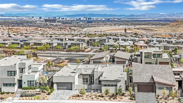 birds eye view of property featuring a mountain view and a residential view