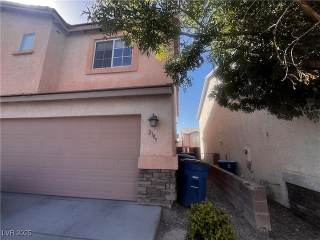 view of home's exterior featuring a garage and stucco siding