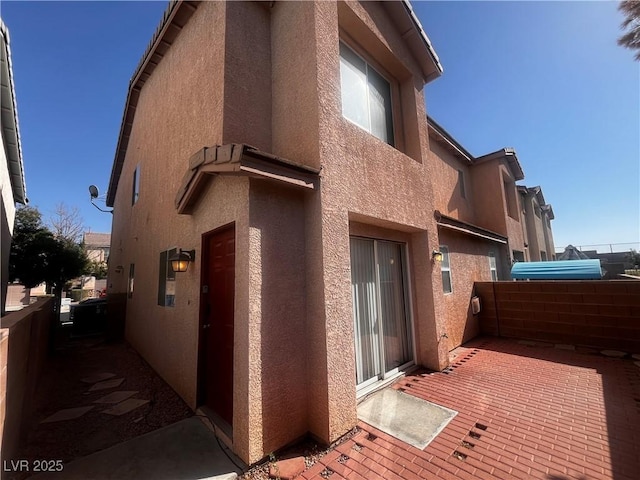 view of property exterior with stucco siding