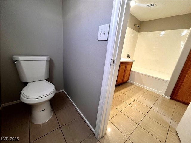 bathroom featuring visible vents, baseboards, toilet, tile patterned floors, and  shower combination