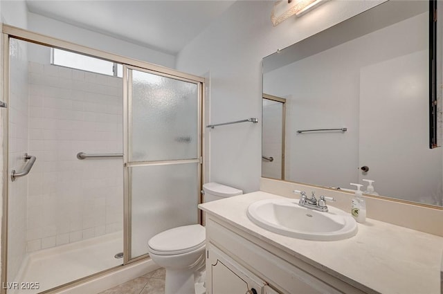 full bathroom with vanity, a shower stall, toilet, and tile patterned floors