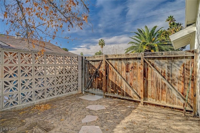 view of gate with fence