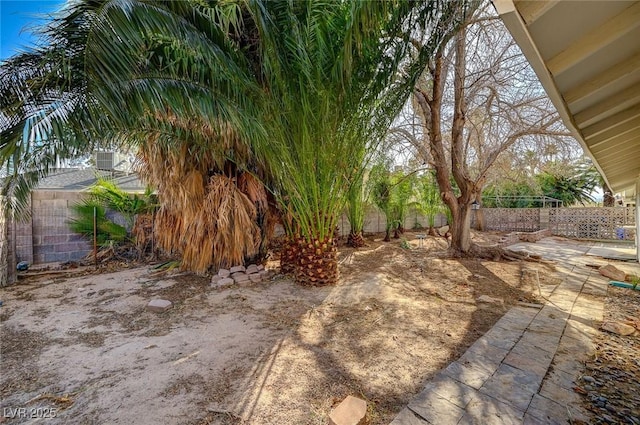 view of yard with a fenced backyard