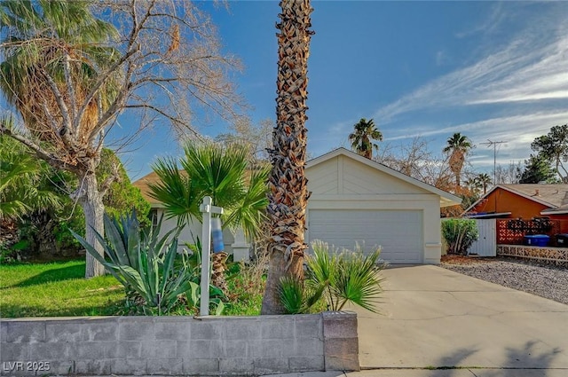 view of front of house with concrete driveway and a garage