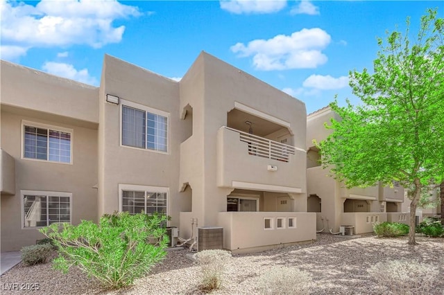 exterior space featuring stucco siding and central AC