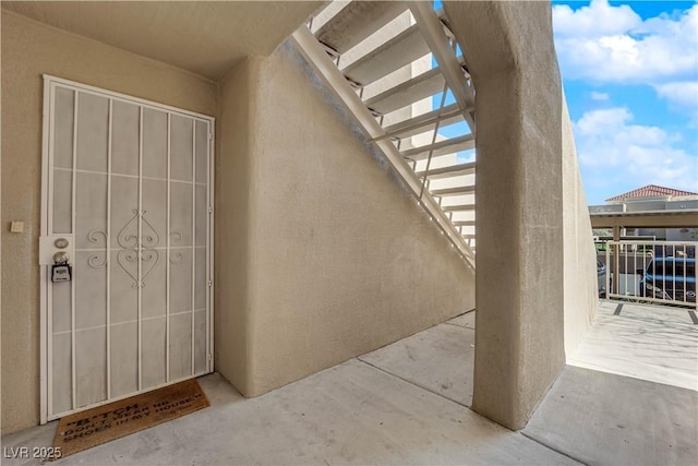 property entrance featuring stucco siding