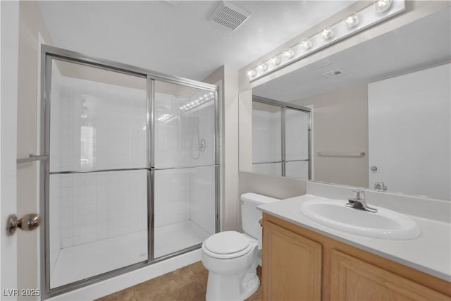 full bath featuring tile patterned floors, visible vents, toilet, a stall shower, and vanity