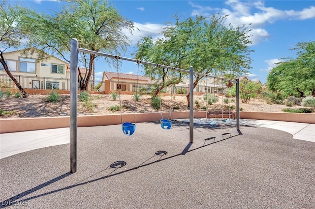 communal playground featuring fence