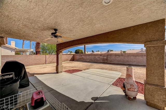 view of patio featuring a ceiling fan and a fenced backyard